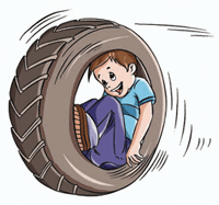 A boy is enjoying a circumgyration in a tire.