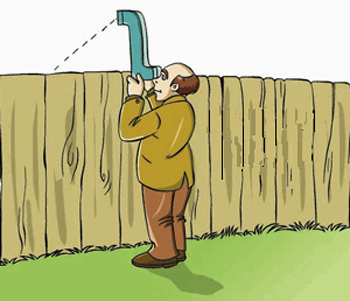 A man uses a periscope to see construction that is going on the other side of a wooden wall.